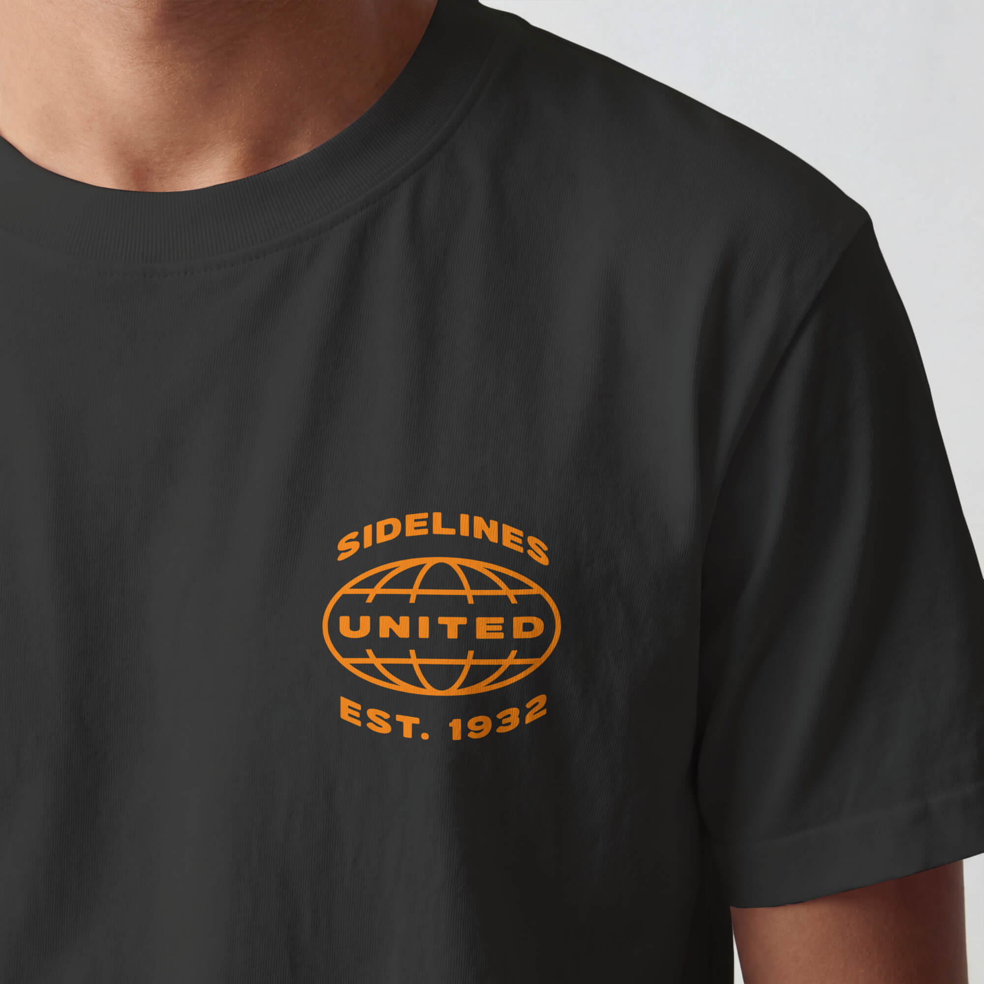 SU front-hit mockup: Mock Ups - Front Hit Orange on Washed Black.jpg