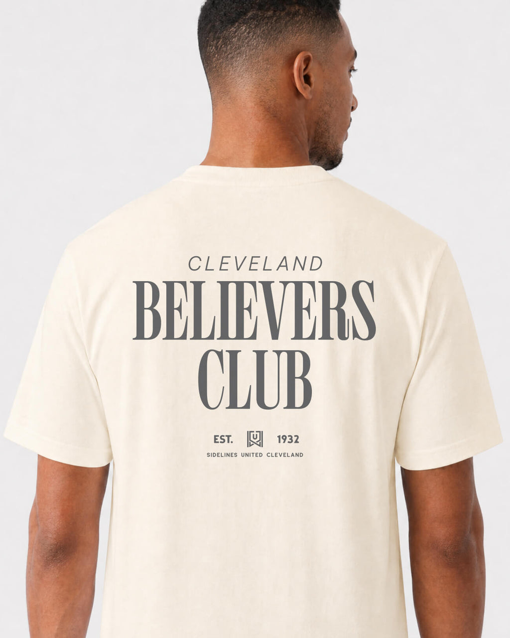 mockup-flatlay_T_Believers-Club---All-Sports_Cleveland_OH_All-Teams_Dark-On-Vintage-White_rel-20260602_id-RXFV9UR.jpg
