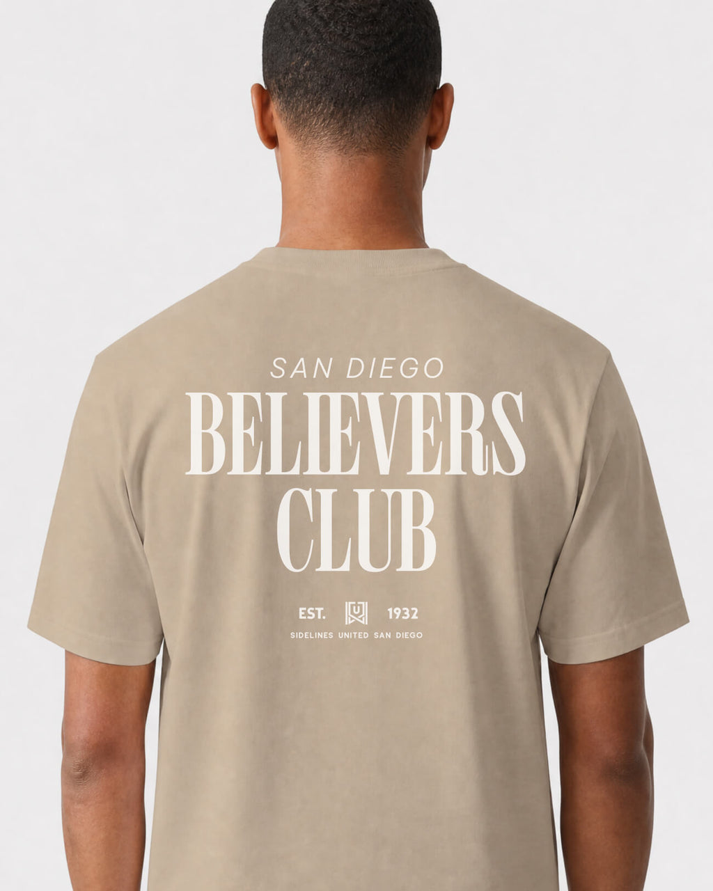 mockup-flatlay_T_Believers-Club---All-Sports_San-Diego_CA_All-Teams_Light-On-Khaki_rel-20260602_id-S111P6N.jpg