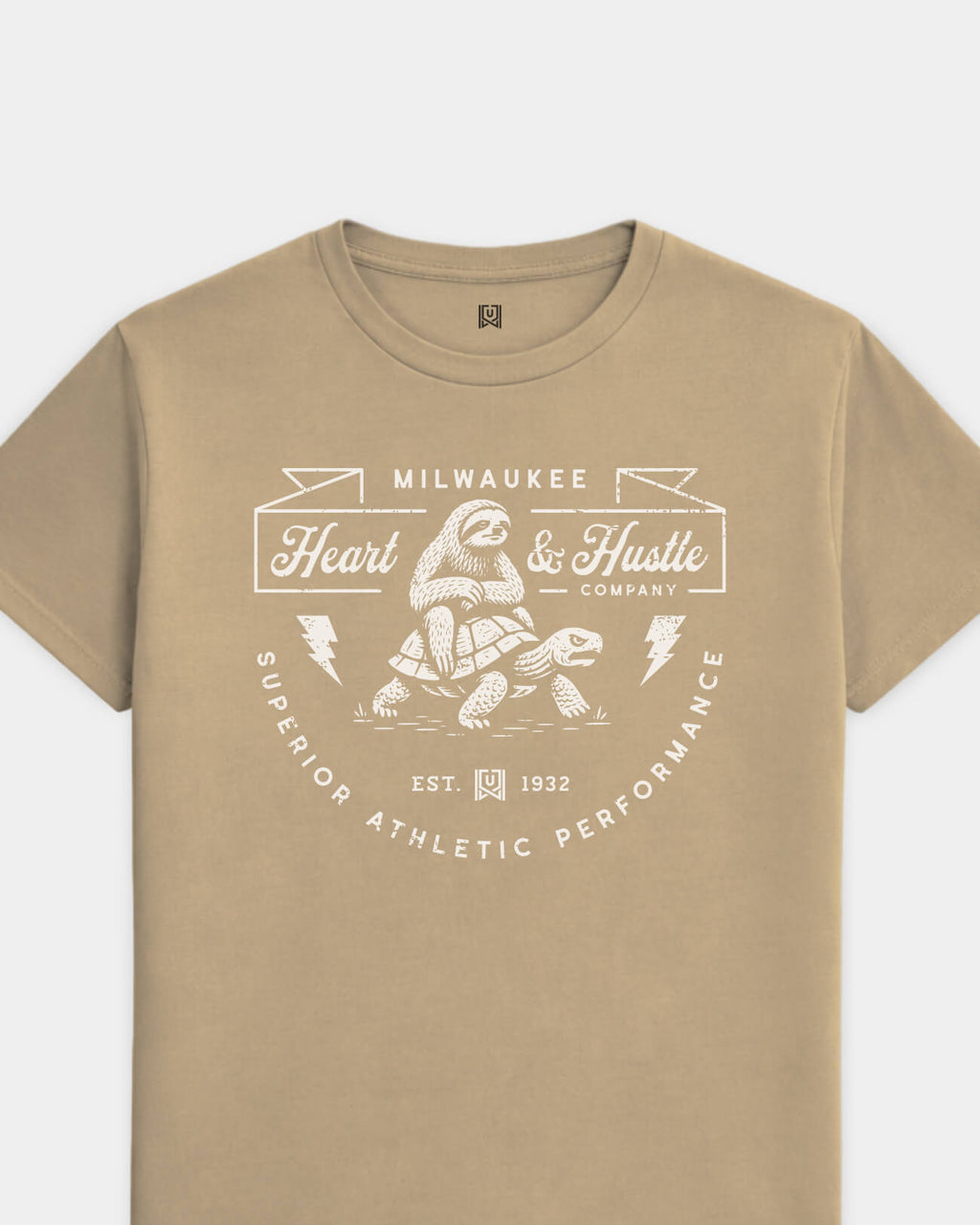 mockup-flatlay_T_Heart-and-Hustle---All-Sports_Milwaukee_WI_All-Teams_Light-On-Khaki_rel-20260602_id-I0SP9J5.jpg