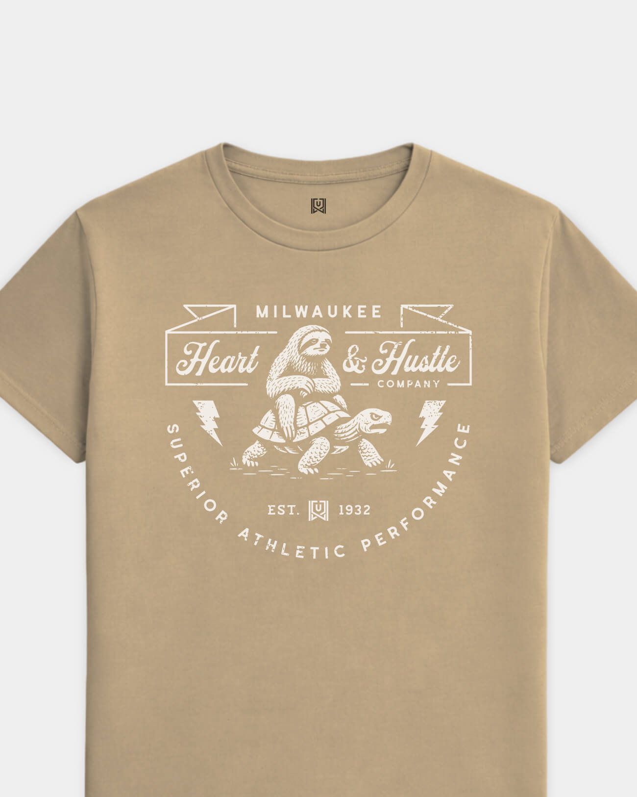 mockup-flatlay_T_Heart-and-Hustle---All-Sports_Milwaukee_WI_All-Teams_Light-On-Khaki_rel-20260602_id-I0SP9J5.jpg