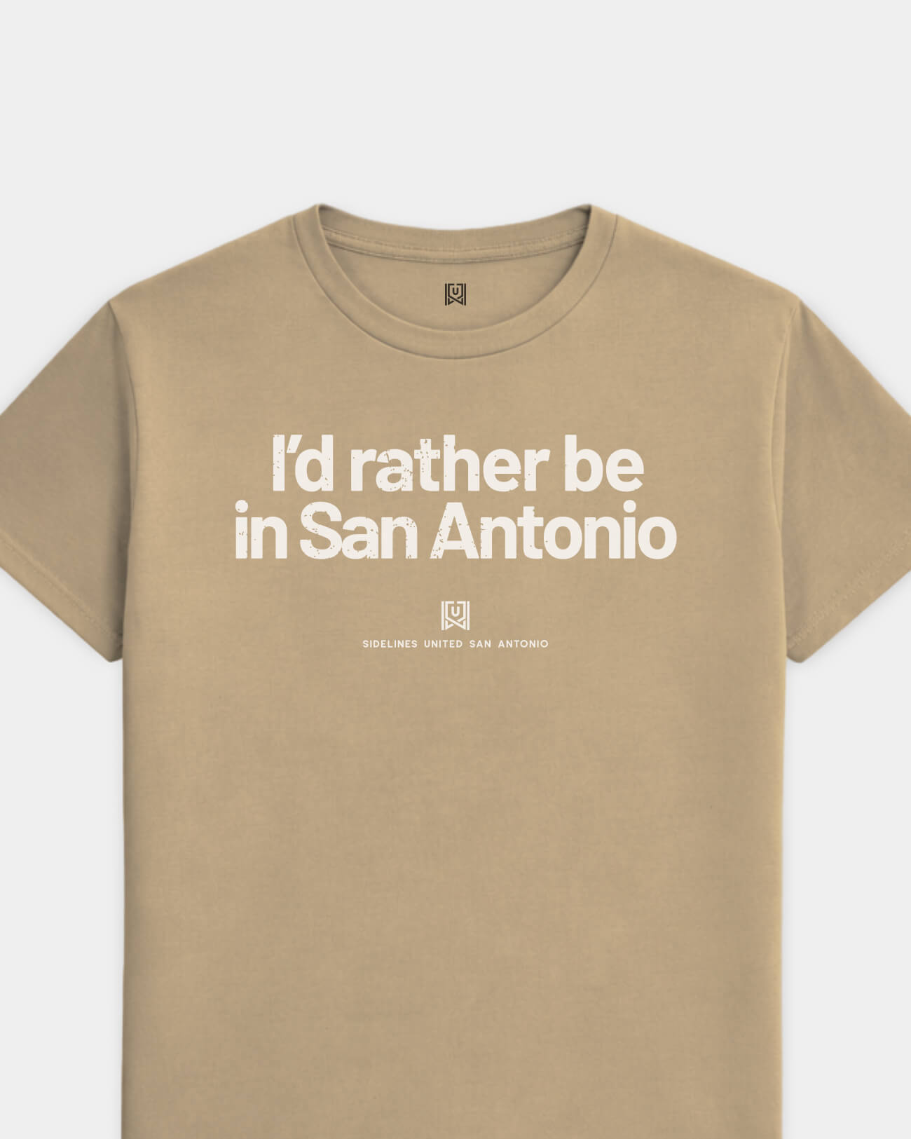 mockup-flatlay_T_Rather-Be---All-Sports_San-Antonio_TX_All-Teams_Light-On-Khaki_rel-20260602_id-S6D96EC.jpg